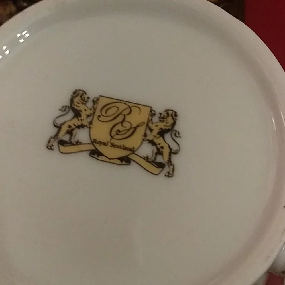 Elegant White Porcelain Teapot with Red and Gold Trim